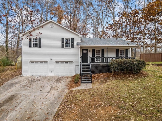 view of front of property with covered porch and a garage