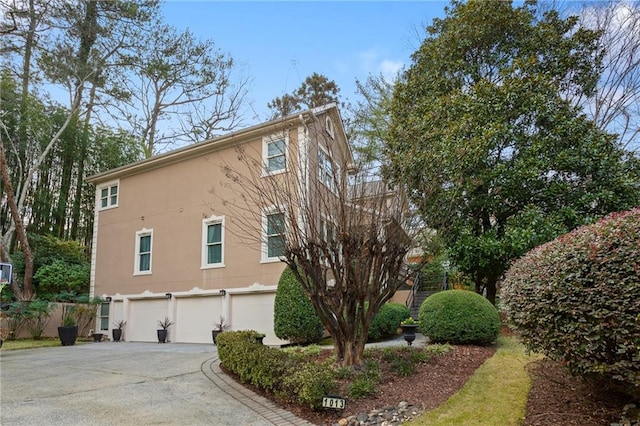 view of side of property featuring a garage