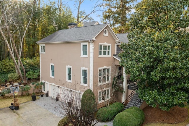 view of side of property with a patio