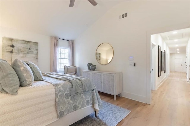 bedroom featuring vaulted ceiling, light hardwood / wood-style flooring, and ceiling fan