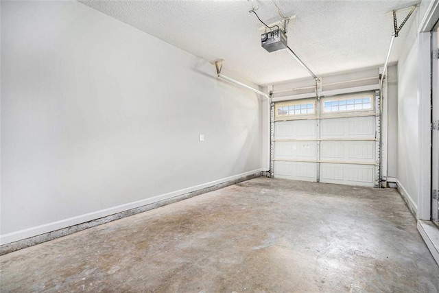 222 Ben Ln, Fairburn, GA 30213 - garage featuring a garage door opener and baseboards