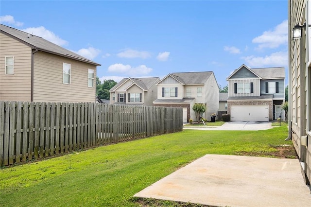222 Ben Ln, Fairburn, GA 30213 - view of yard with a residential view, a patio, and an attached garage