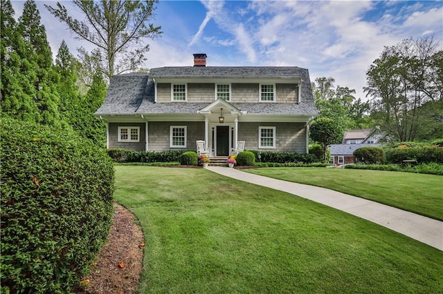 1658 E Clifton Rd NE, Atlanta, GA 30307 - view of front of property with a front yard and a chimney