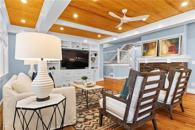 1658 E Clifton Rd NE, Atlanta, GA 30307 - living area featuring a wood ceiling with exposed beams, wood finished floors, ceiling fan, stairs, and built in features