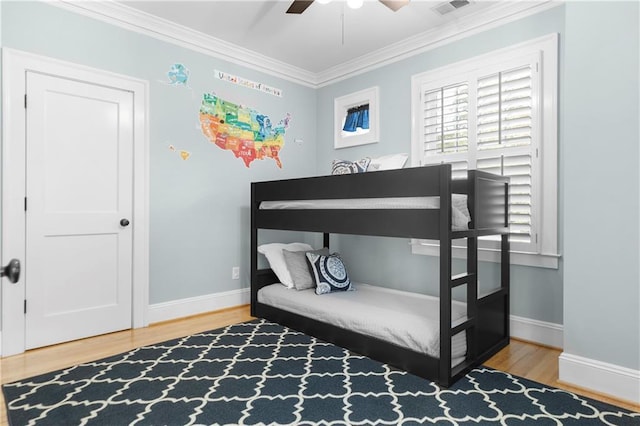 1658 E Clifton Rd NE, Atlanta, GA 30307 - bedroom with wood finished floors, ornamental molding, and ceiling fan