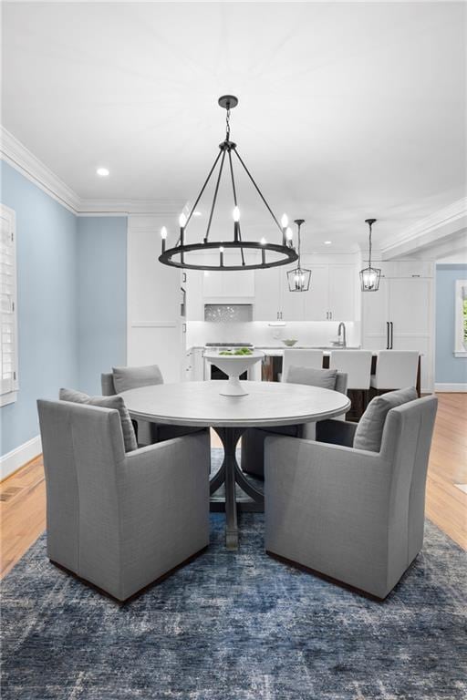 1658 E Clifton Rd NE, Atlanta, GA 30307 - living area with a chandelier, ornamental molding, wood finished floors, and recessed lighting