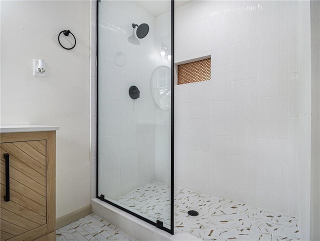 full bath featuring a walk in shower and baseboards