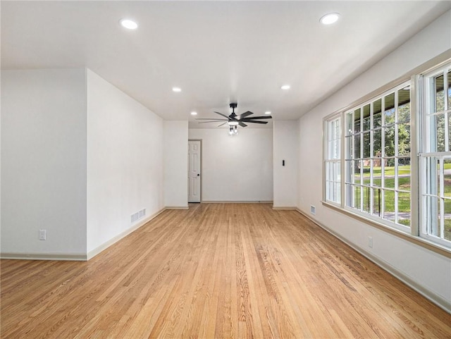 unfurnished room with recessed lighting, visible vents, and light wood-type flooring