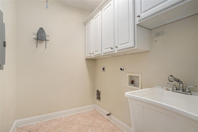 clothes washing area with electric dryer hookup, hookup for a washing machine, cabinets, gas dryer hookup, and sink