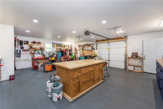 2801 Henderson Mountain Rd, Jasper, GA 30143 - garage featuring a workshop area, a garage door opener, and recessed lighting