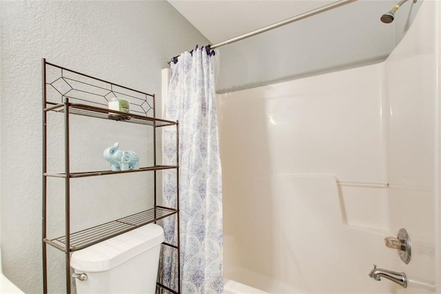 full bathroom with shower / bath combination with curtain and toilet