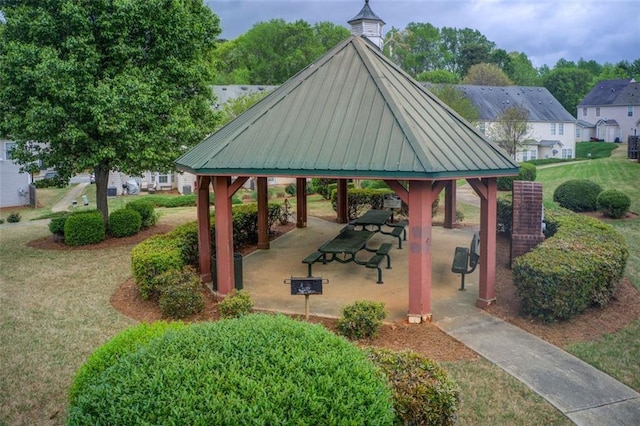 surrounding community with a gazebo, a patio area, and a yard