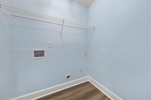 clothes washing area with washer hookup, wood-type flooring, and hookup for an electric dryer