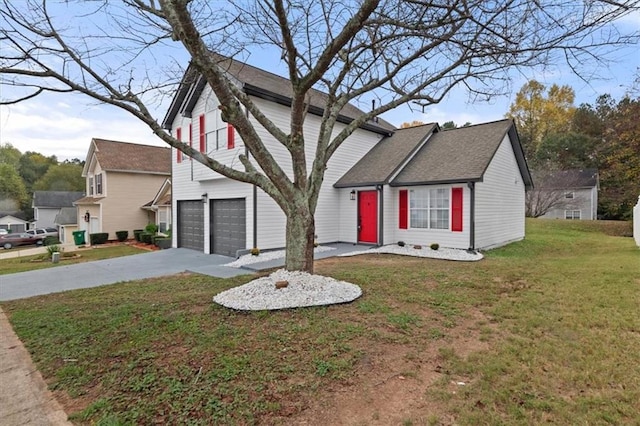 view of front of home featuring a garage and a front yard