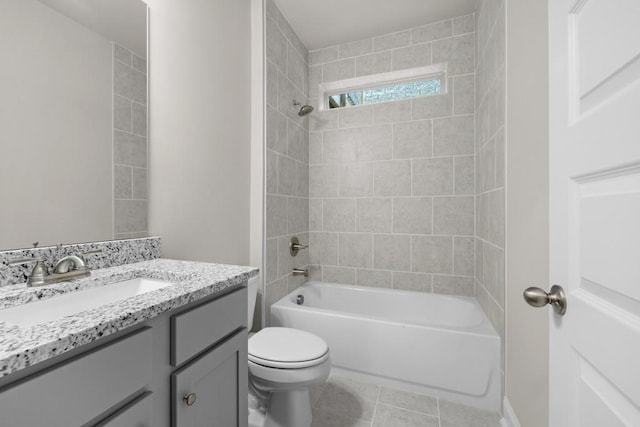 full bath with tile patterned floors, vanity, shower / tub combination, and toilet