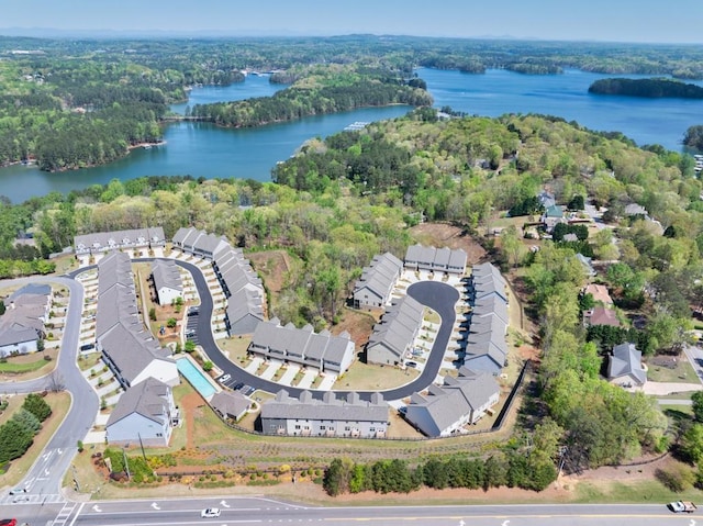 bird's eye view featuring a water view and a forest view