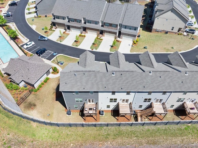 birds eye view of property with a residential view