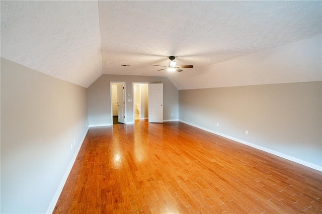 1200 Martins Chapel Ln SE, Lawrenceville, GA 30045 - additional living space featuring a textured ceiling, a ceiling fan, light wood-type flooring, and vaulted ceiling