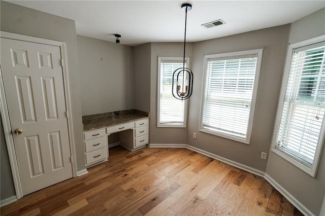 1200 Martins Chapel Ln SE, Lawrenceville, GA 30045 - unfurnished office with light wood-style flooring and built in desk