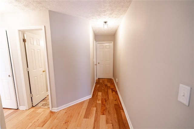 1200 Martins Chapel Ln SE, Lawrenceville, GA 30045 - corridor with light wood-type flooring and a textured ceiling