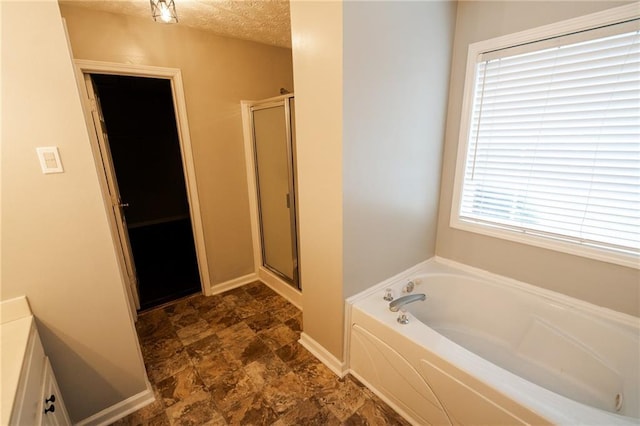 1200 Martins Chapel Ln SE, Lawrenceville, GA 30045 - full bath with a garden tub, a shower stall, and stone finish flooring