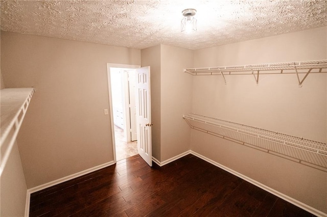 1200 Martins Chapel Ln SE, Lawrenceville, GA 30045 - walk in closet featuring dark wood-type flooring