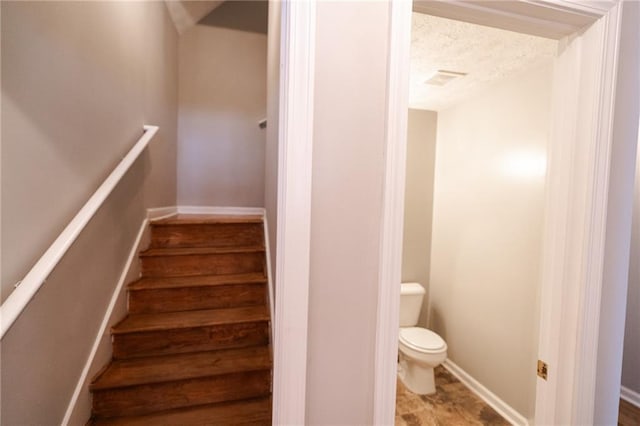 1200 Martins Chapel Ln SE, Lawrenceville, GA 30045 - stairway featuring a textured ceiling