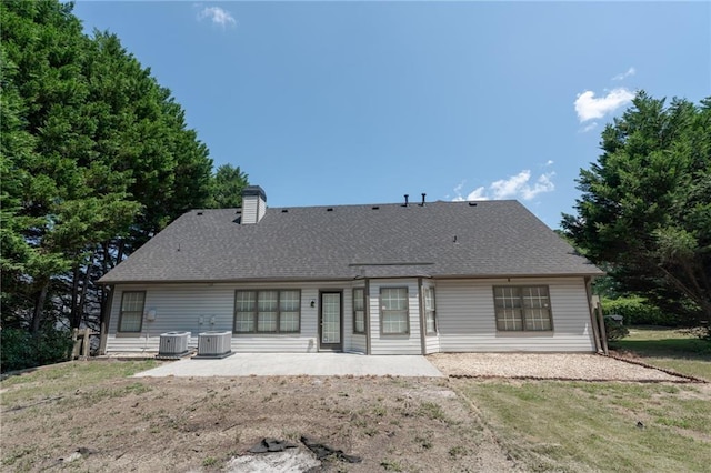 1200 Martins Chapel Ln SE, Lawrenceville, GA 30045 - back of property featuring a patio area, a chimney, a yard, and a shingled roof