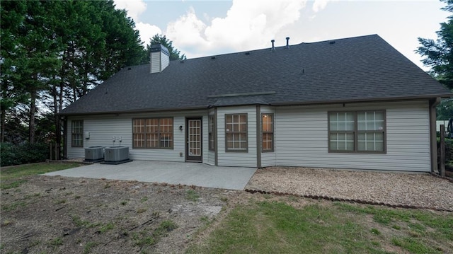 1200 Martins Chapel Ln SE, Lawrenceville, GA 30045 - rear view of house with a patio, a chimney, and a shingled roof