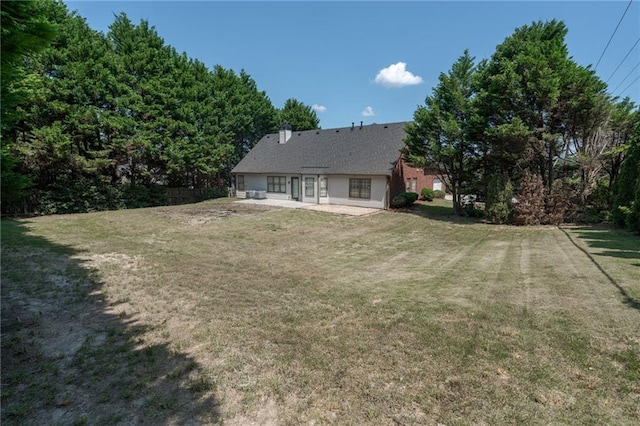 1200 Martins Chapel Ln SE, Lawrenceville, GA 30045 - back of property with a yard and a patio