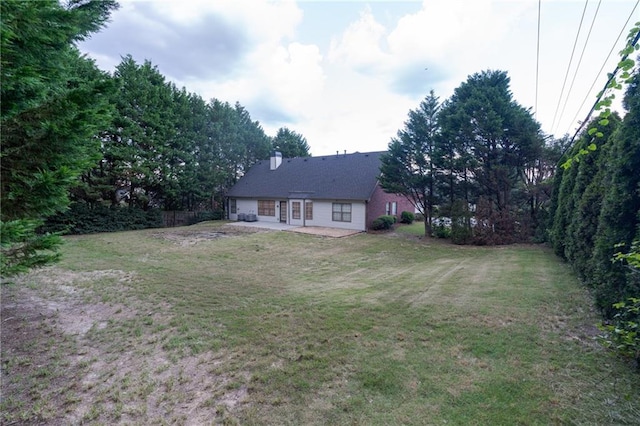 1200 Martins Chapel Ln SE, Lawrenceville, GA 30045 - view of green lawn featuring a patio area