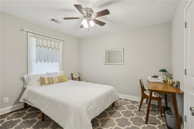 bedroom with visible vents, baseboards, and a ceiling fan
