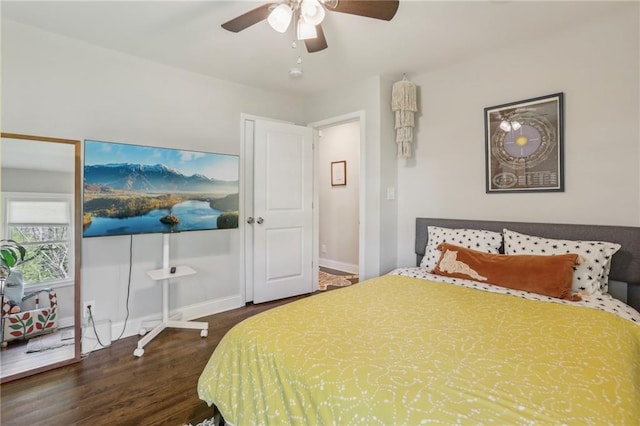 bedroom with wood finished floors, ceiling fan, and baseboards