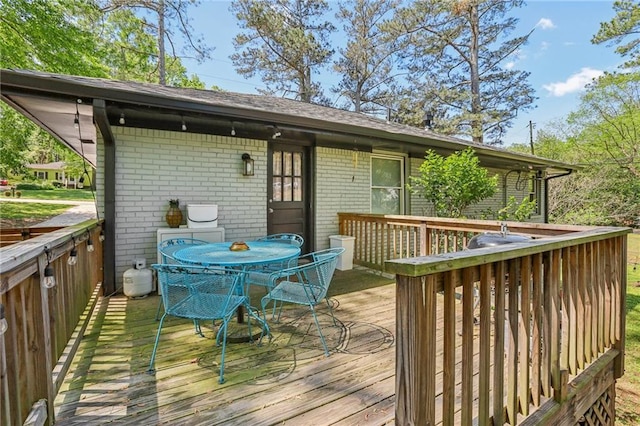 wooden deck with outdoor dining area