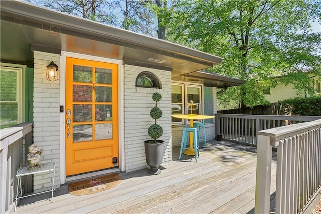 property entrance with brick siding