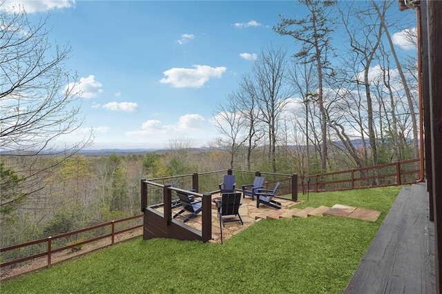 view of yard with a fire pit