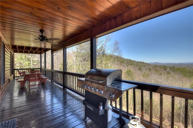 deck featuring a grill and ceiling fan