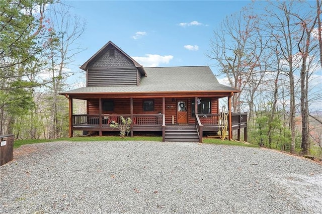 log cabin featuring a porch