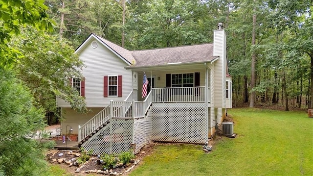 1341 Little Deer Run, Canton, GA 30114 - view of front of home featuring a chimney, a front lawn, a porch, stairway, and a forest view