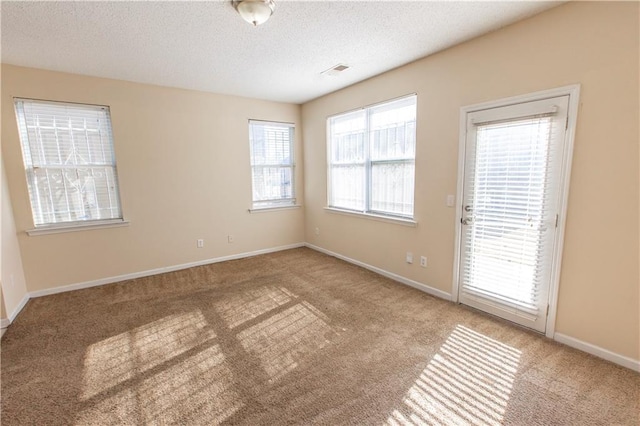 1830 Bayrose Cir Unit 30B, East Point, GA 30344 - carpeted empty room featuring a textured ceiling, baseboards, and visible vents
