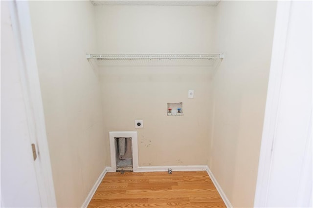 1830 Bayrose Cir Unit 30B, East Point, GA 30344 - washroom featuring light wood-style flooring, laundry area, hookup for an electric dryer, hookup for a washing machine, and baseboards