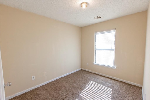 1830 Bayrose Cir Unit 30B, East Point, GA 30344 - unfurnished room featuring baseboards, carpet flooring, visible vents, and a textured ceiling