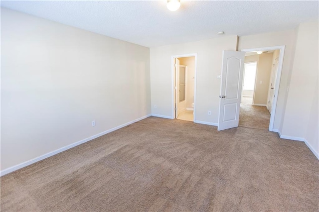 1830 Bayrose Cir Unit 30B, East Point, GA 30344 - unfurnished bedroom featuring a textured ceiling, baseboards, and carpet floors