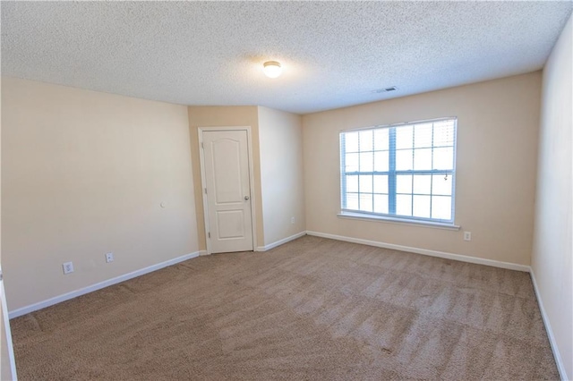 1830 Bayrose Cir Unit 30B, East Point, GA 30344 - spare room with a textured ceiling, carpet flooring, baseboards, and visible vents