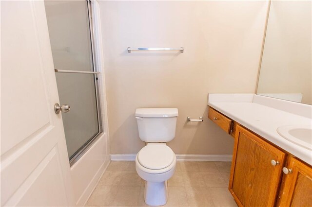 1830 Bayrose Cir Unit 30B, East Point, GA 30344 - bathroom with toilet, combined bath / shower with glass door, tile patterned floors, baseboards, and vanity