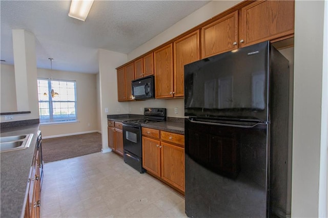 1830 Bayrose Cir Unit 30B, East Point, GA 30344 - kitchen featuring brown cabinetry, black appliances, baseboards, and light floors