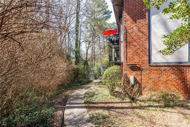 view of side of property with brick siding