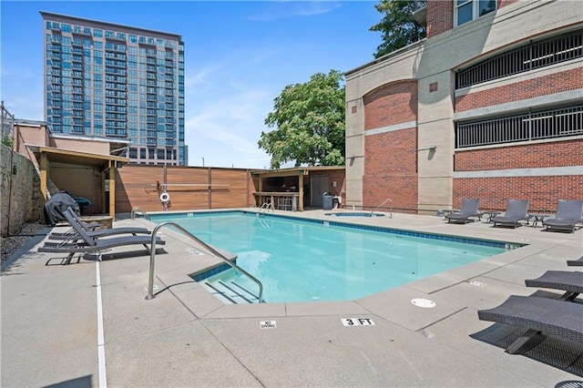 view of pool featuring a patio area