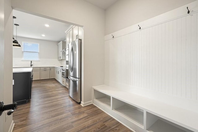 mudroom featuring sink and dark hardwood / wood-style flooring