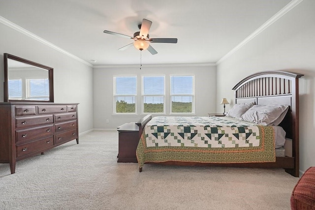 bedroom featuring ceiling fan, crown molding, and light carpet